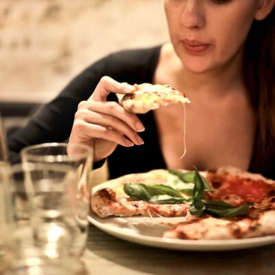 Woman Eating Pizza