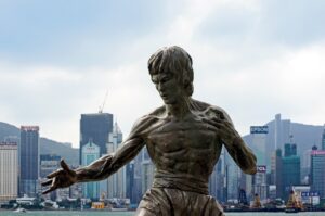 How did Bruce Lee die, and why is his death so controversial?