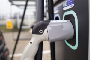 How do electric car charging stations/companies make money?