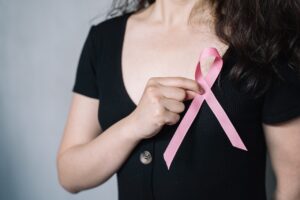 How did the pink ribbon become the symbol for breast cancer awareness?